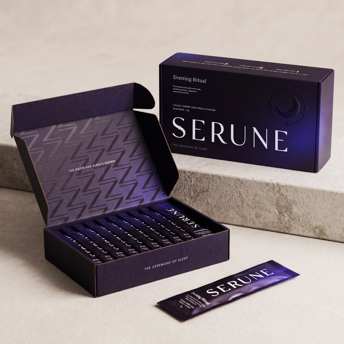 The Serune box open and closed on a stone slab, with a sachet in front